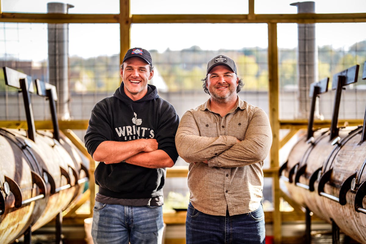 a person standing next to a window