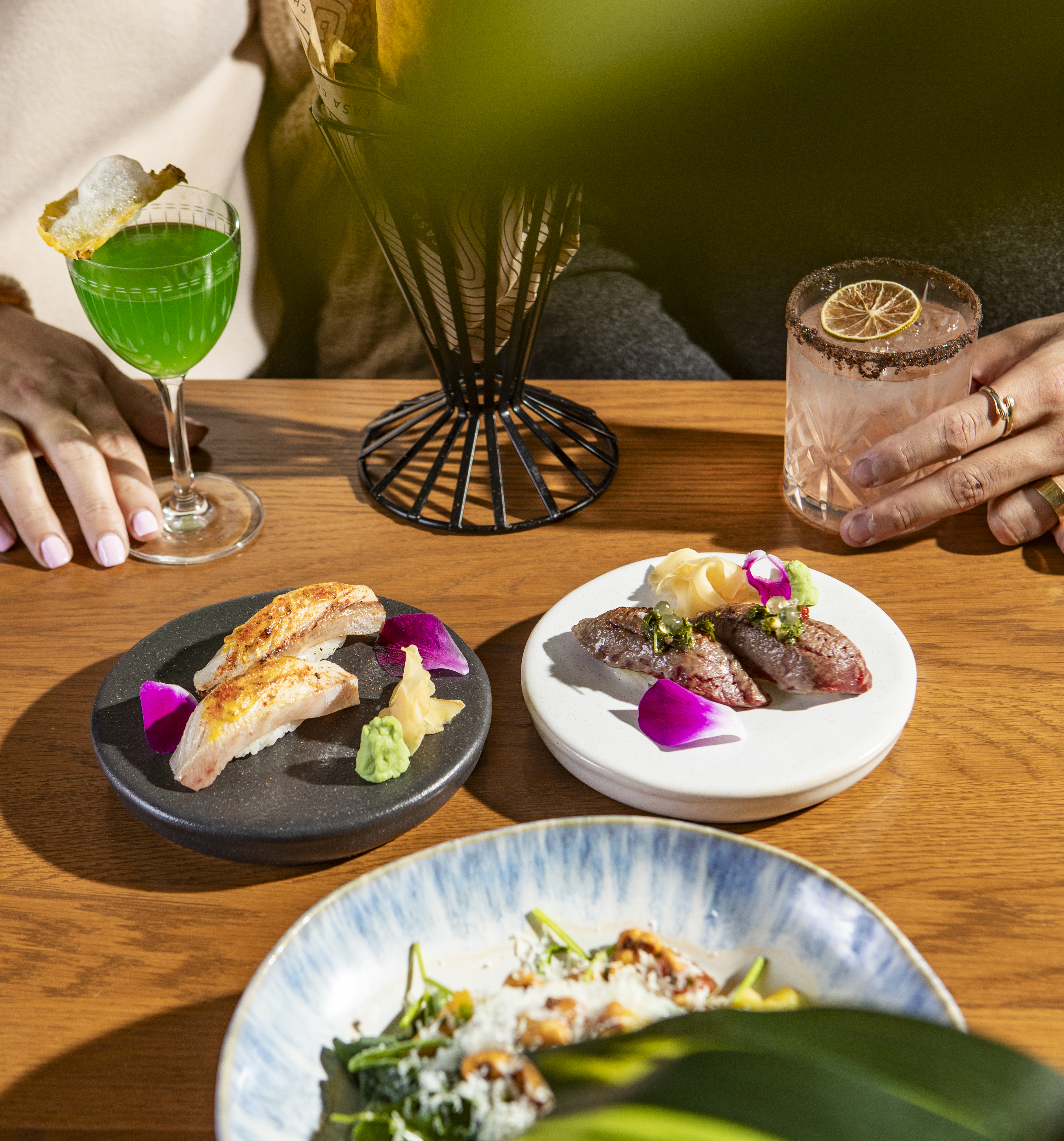 a plate of food sitting on top of a wooden table