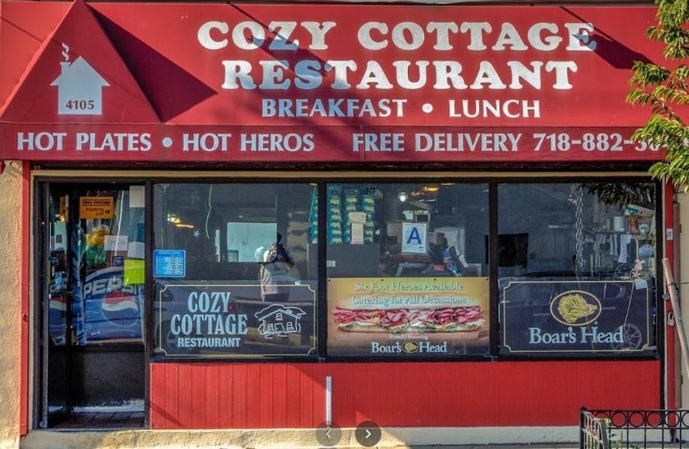 a sign on an awning on the side of a building