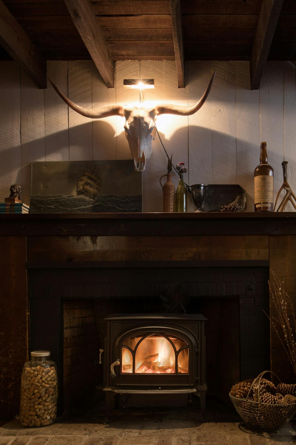 a fire place sitting in a living room with a stone fireplace