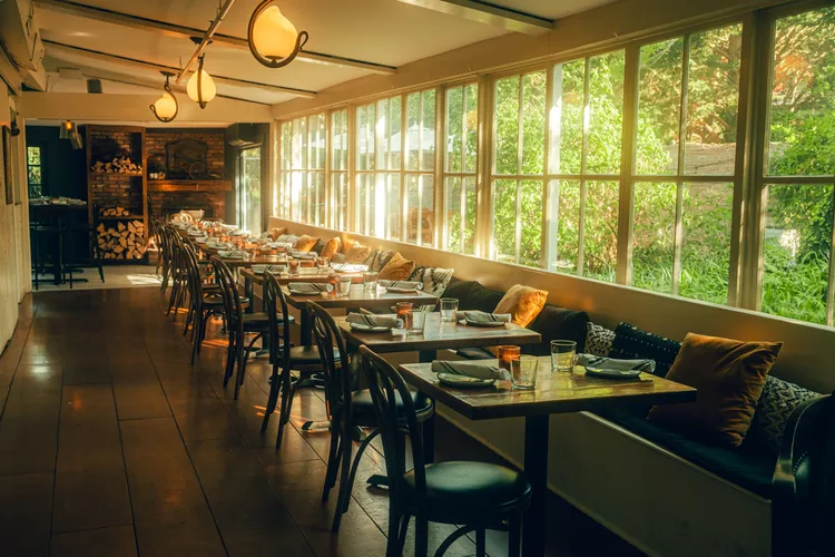 a long room with tables and chairs