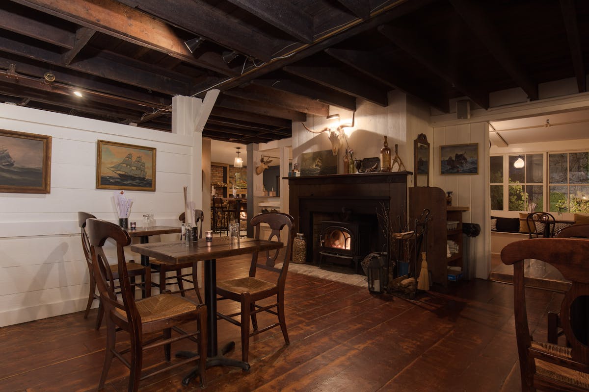 a living room filled with furniture and a fire place