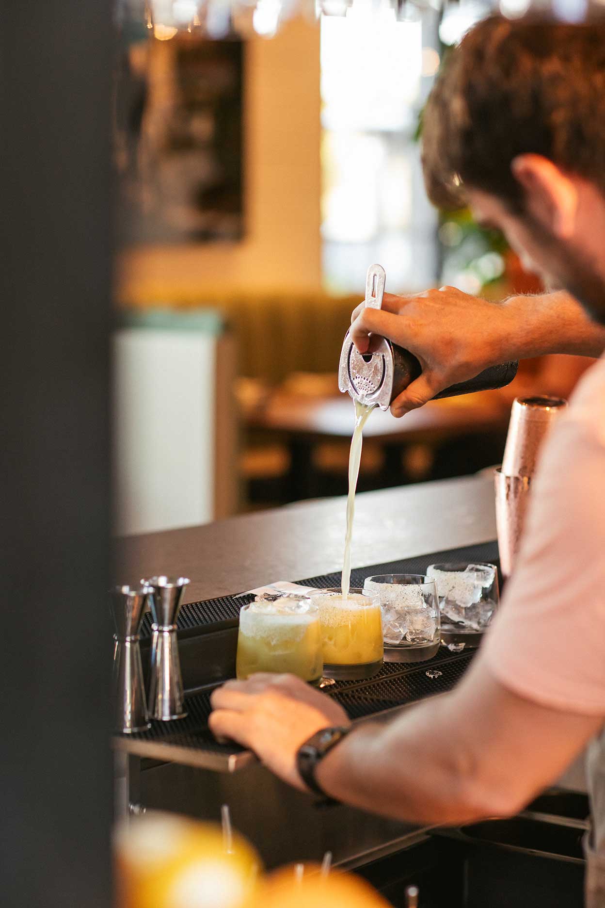 a man standing in a kitchen preparing food
