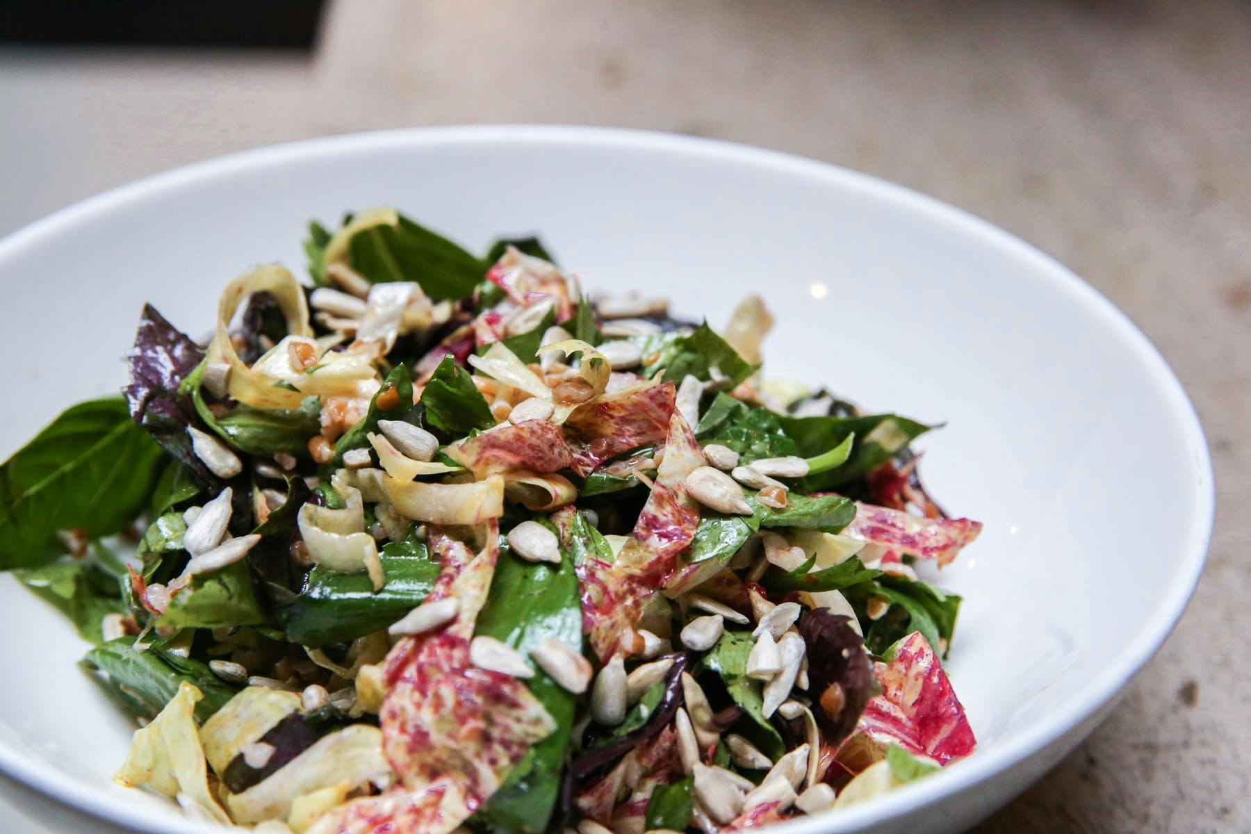 a bowl of salad on a plate