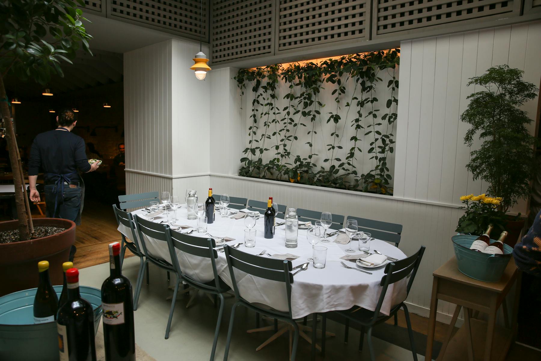 a kitchen with a table and chairs