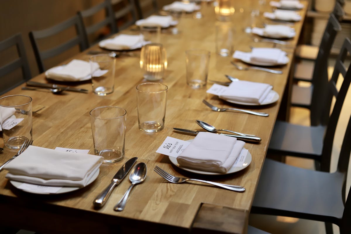 a dining table filled with wine glasses