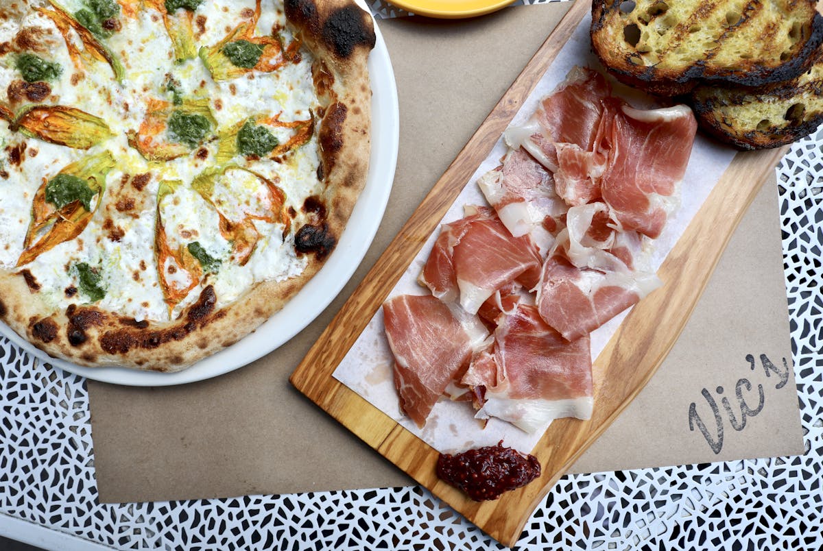 a slice of pizza sitting on top of a wooden table