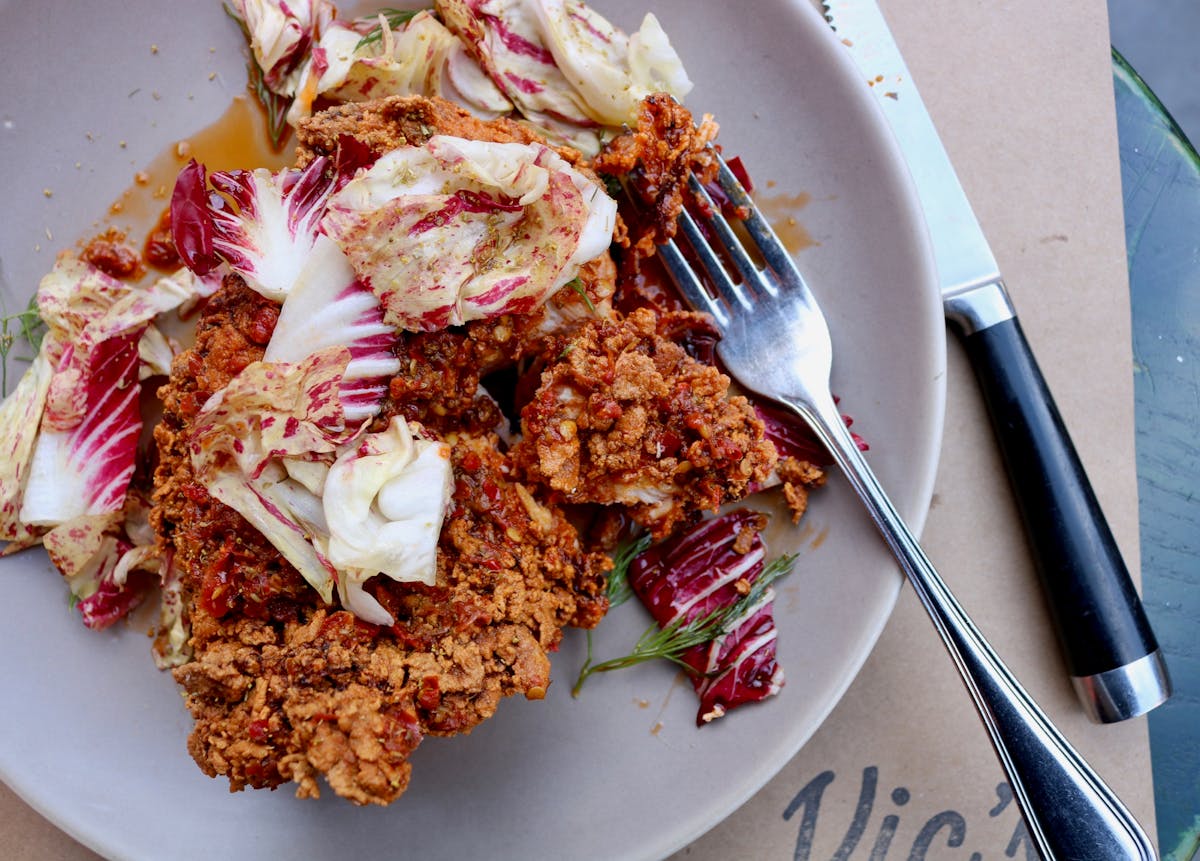 a plate of food with a fork and knife