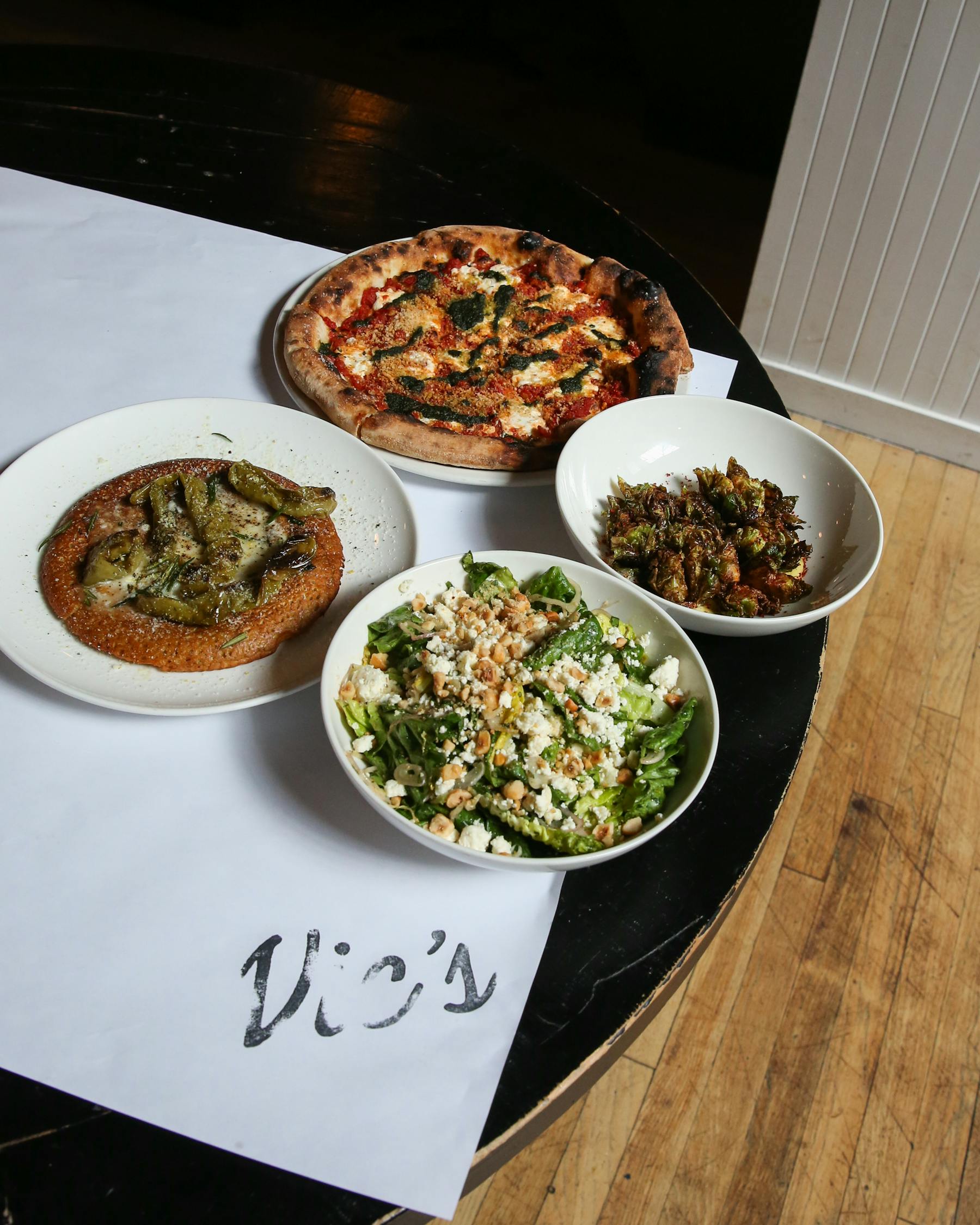 a bowl of food on a plate on a table