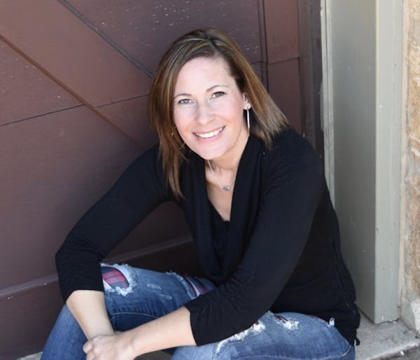 a woman smiling for the camera