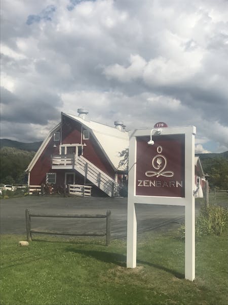 a sign in front of a house