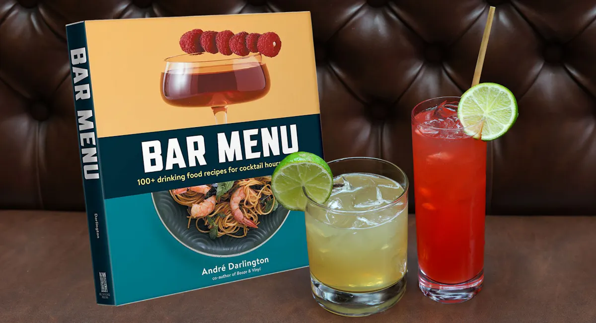two cocktails next to a book