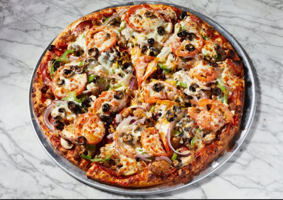 a pizza sitting on top of a table