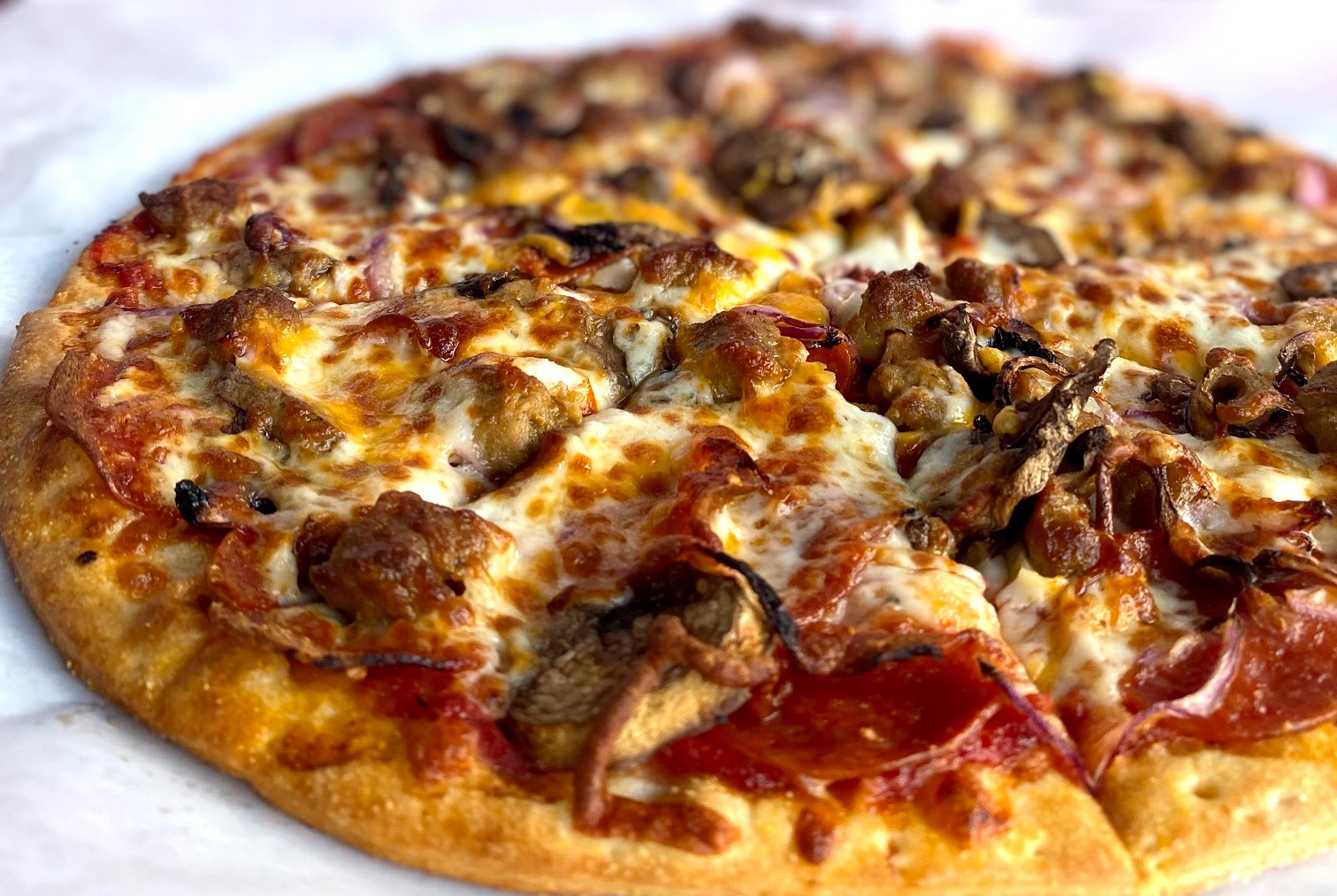 a close up of a slice of pizza