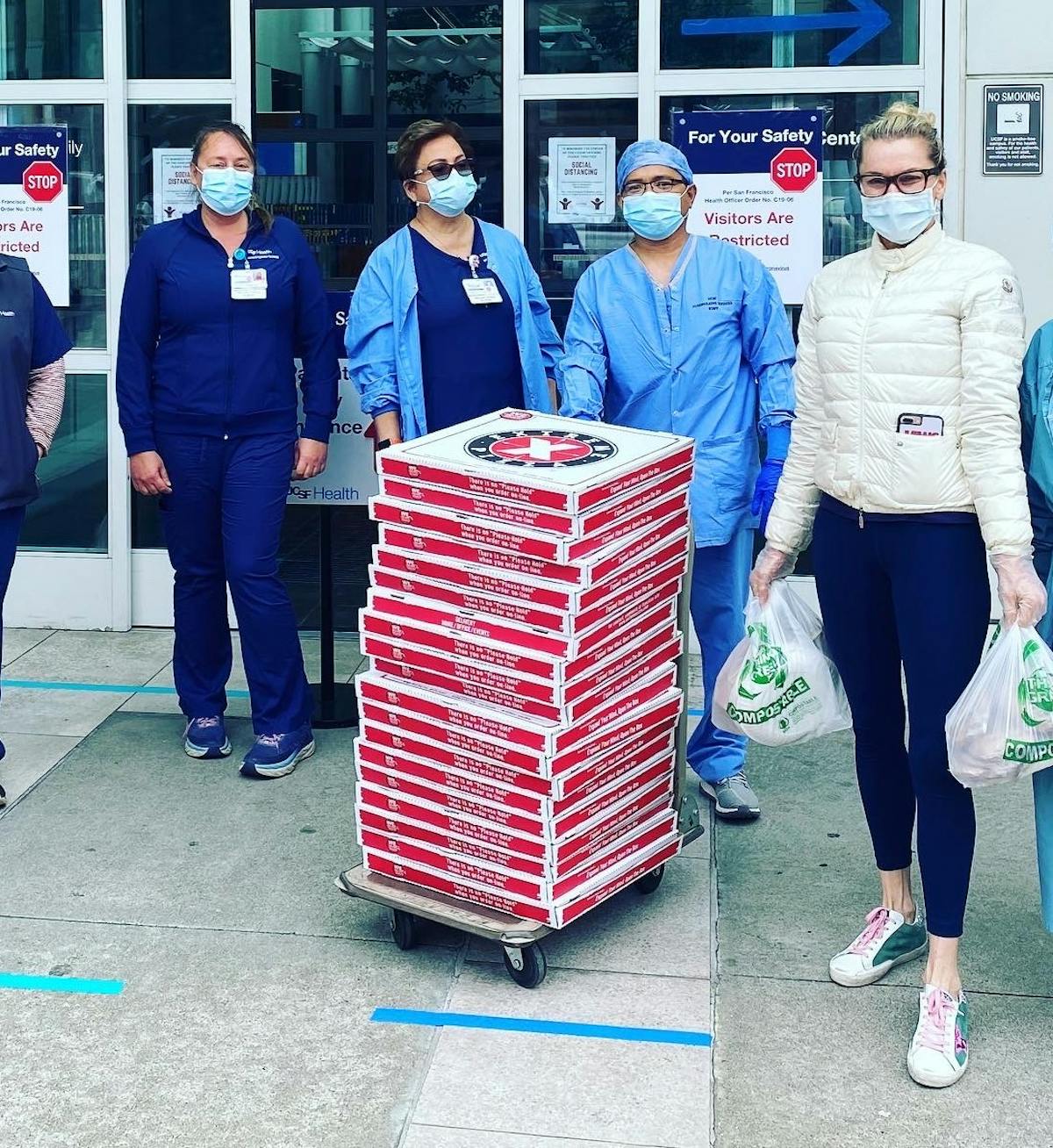 a group of people standing in front of a building