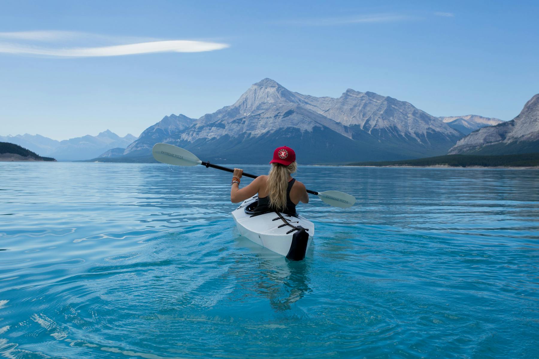 a female kayaker on a lake