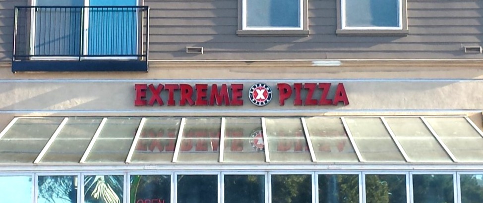 a sign above a store window