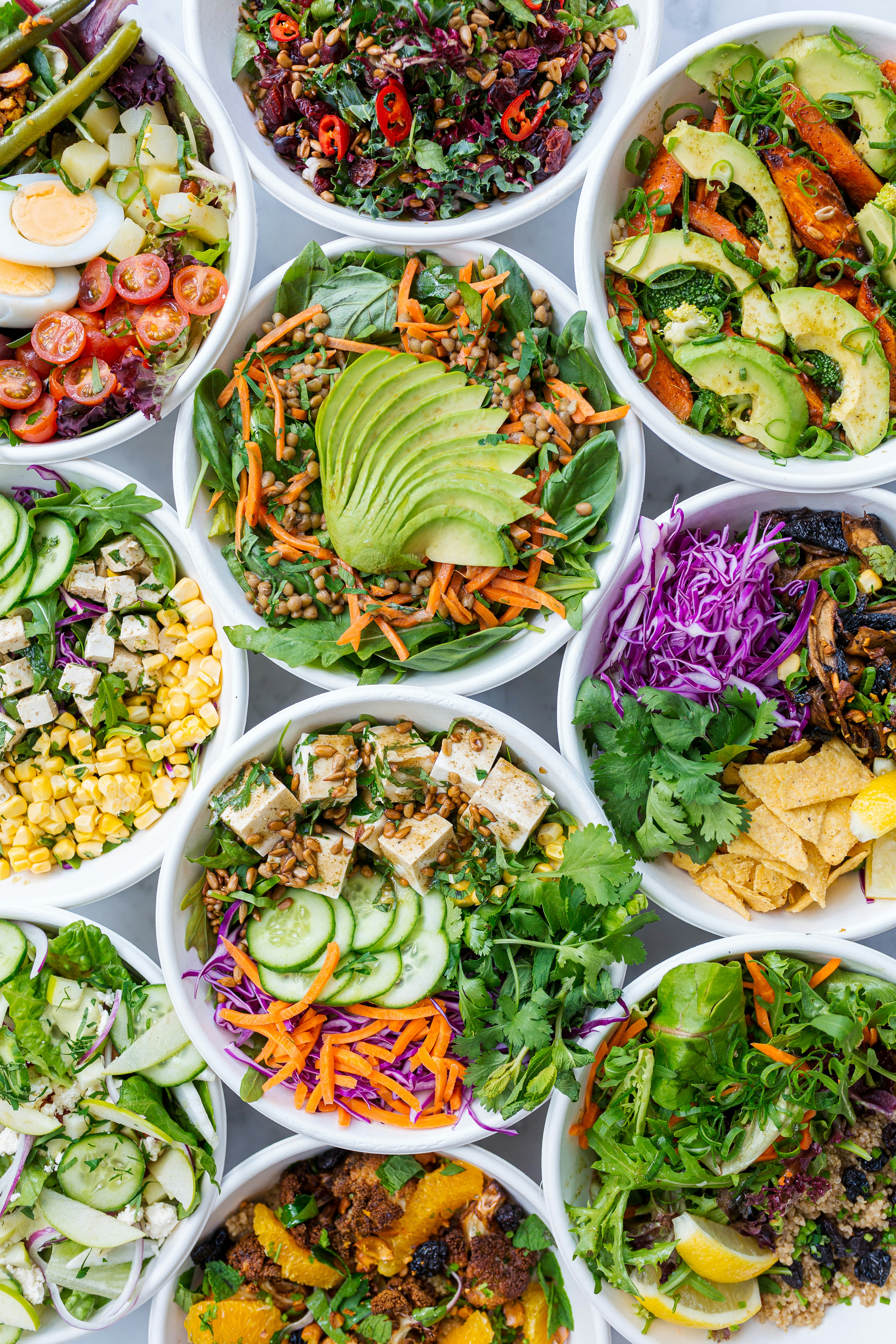 a bowl filled with different types of food on a table