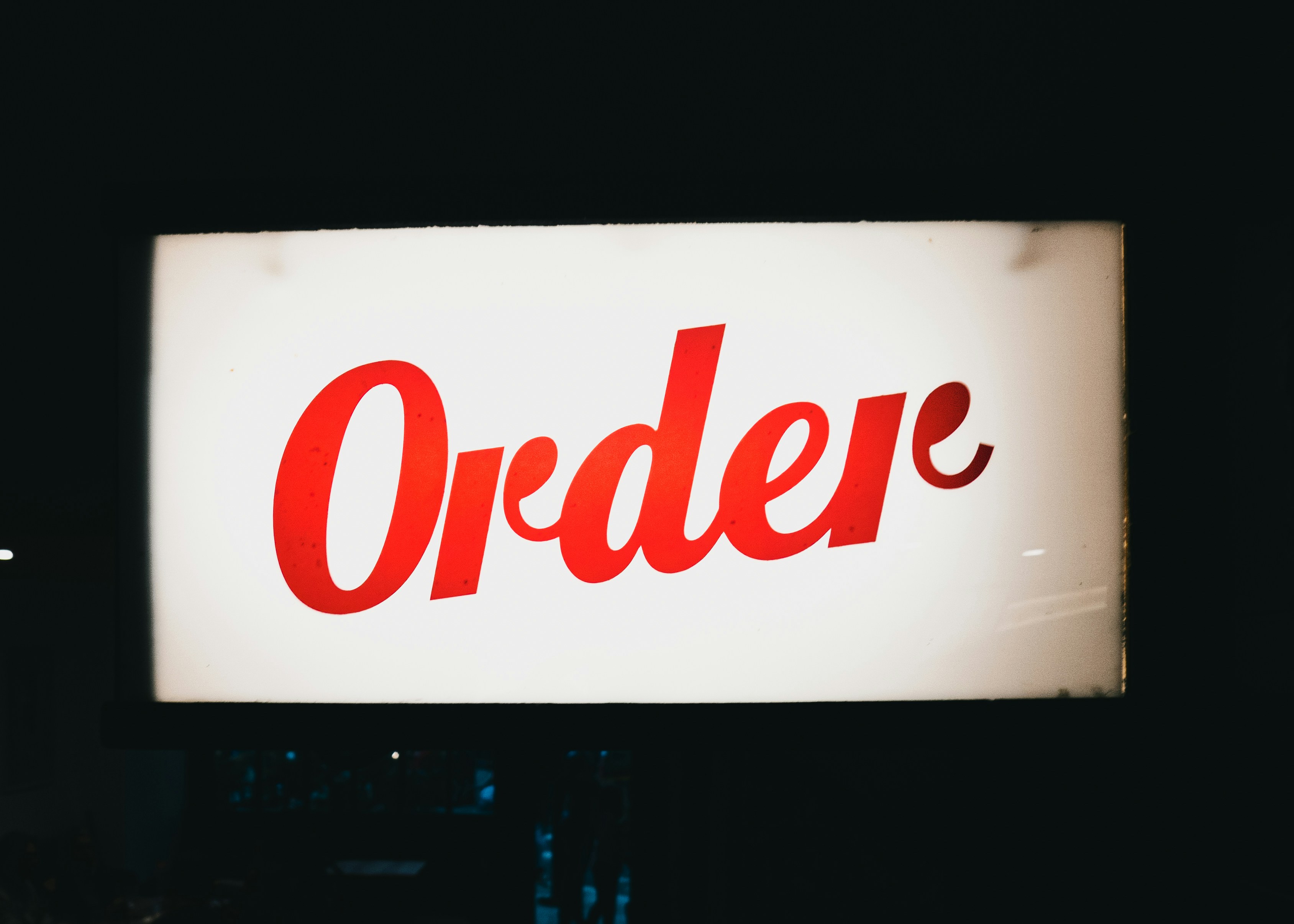 a sign with red text