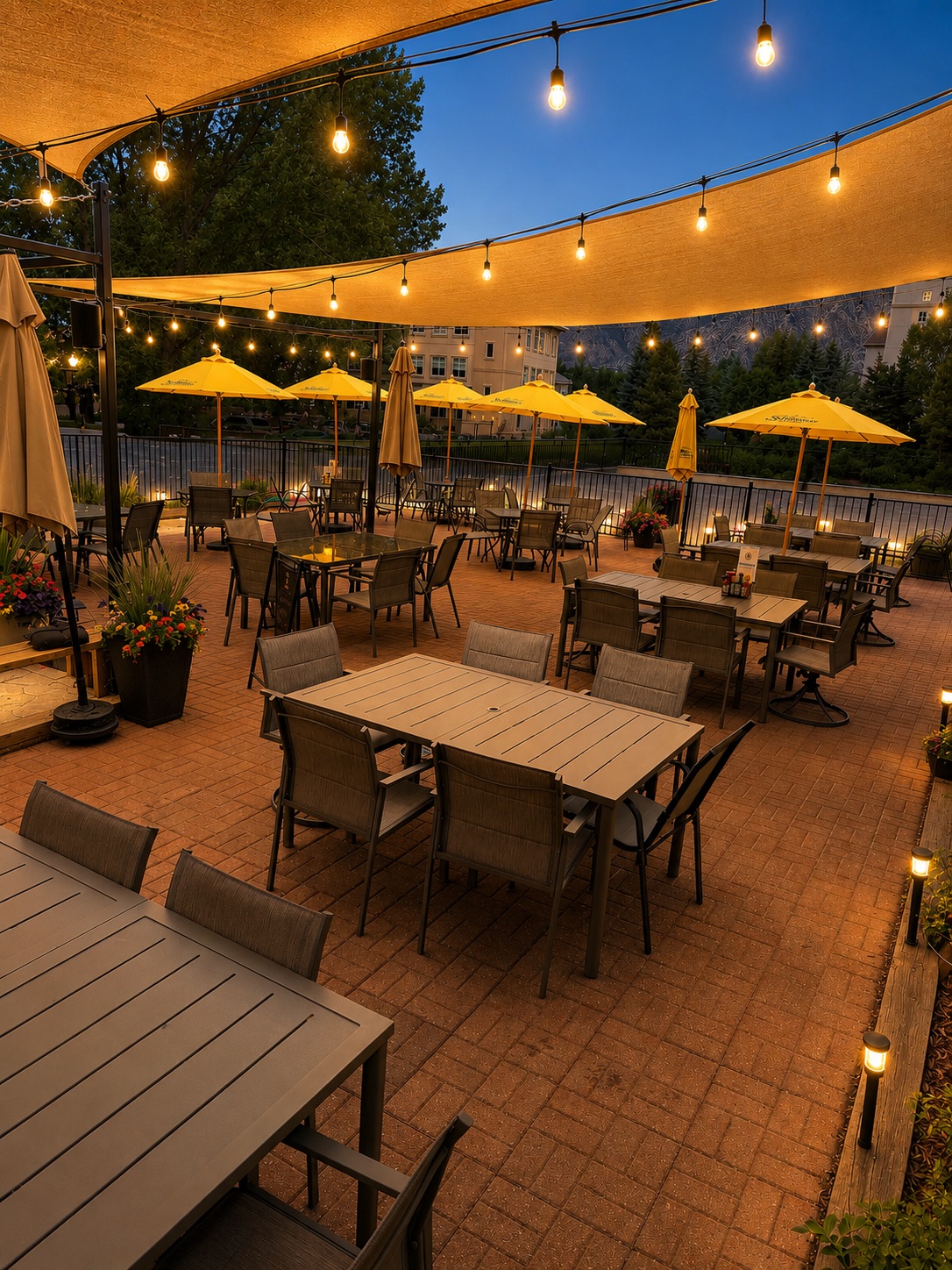a patio with tables and umbrellas