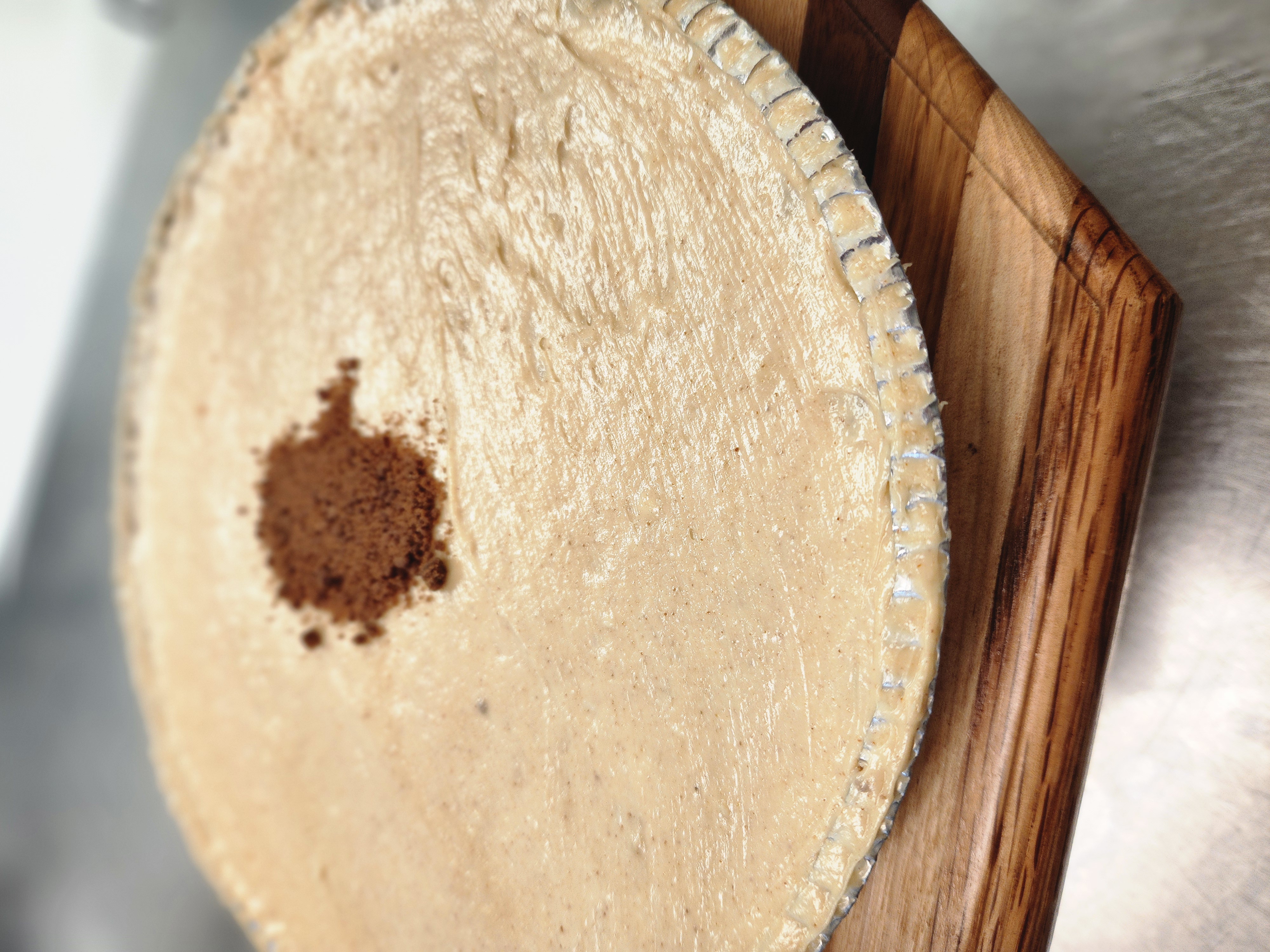 a piece of cake sitting on top of a wooden cutting board