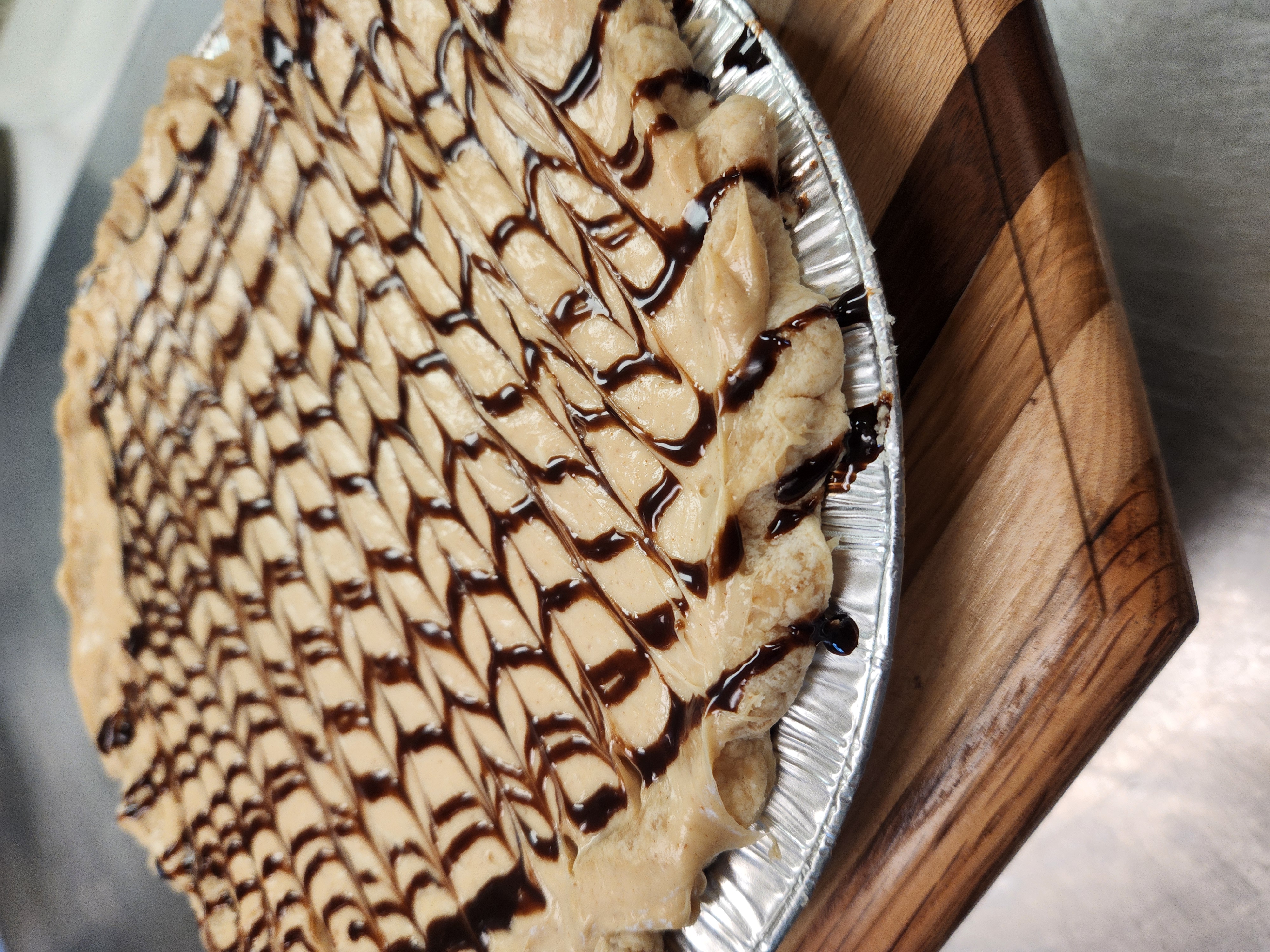 a piece of cake sitting on top of a wooden cutting board