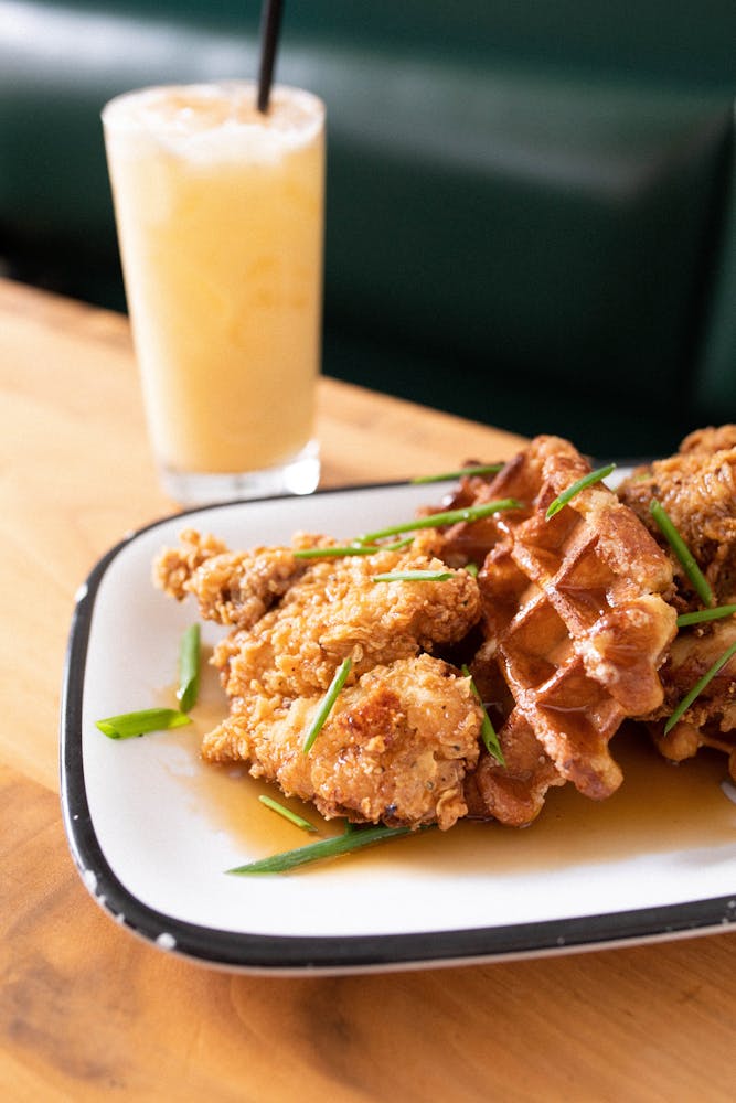 a person holding a plate of food