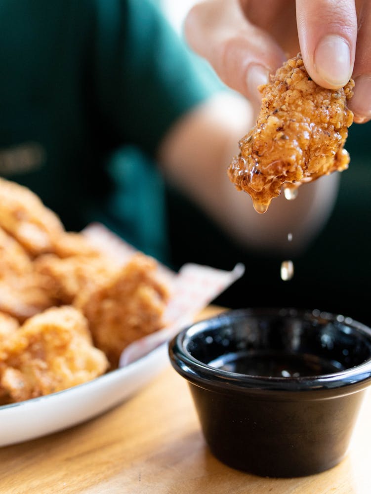 a person holding a plate of food