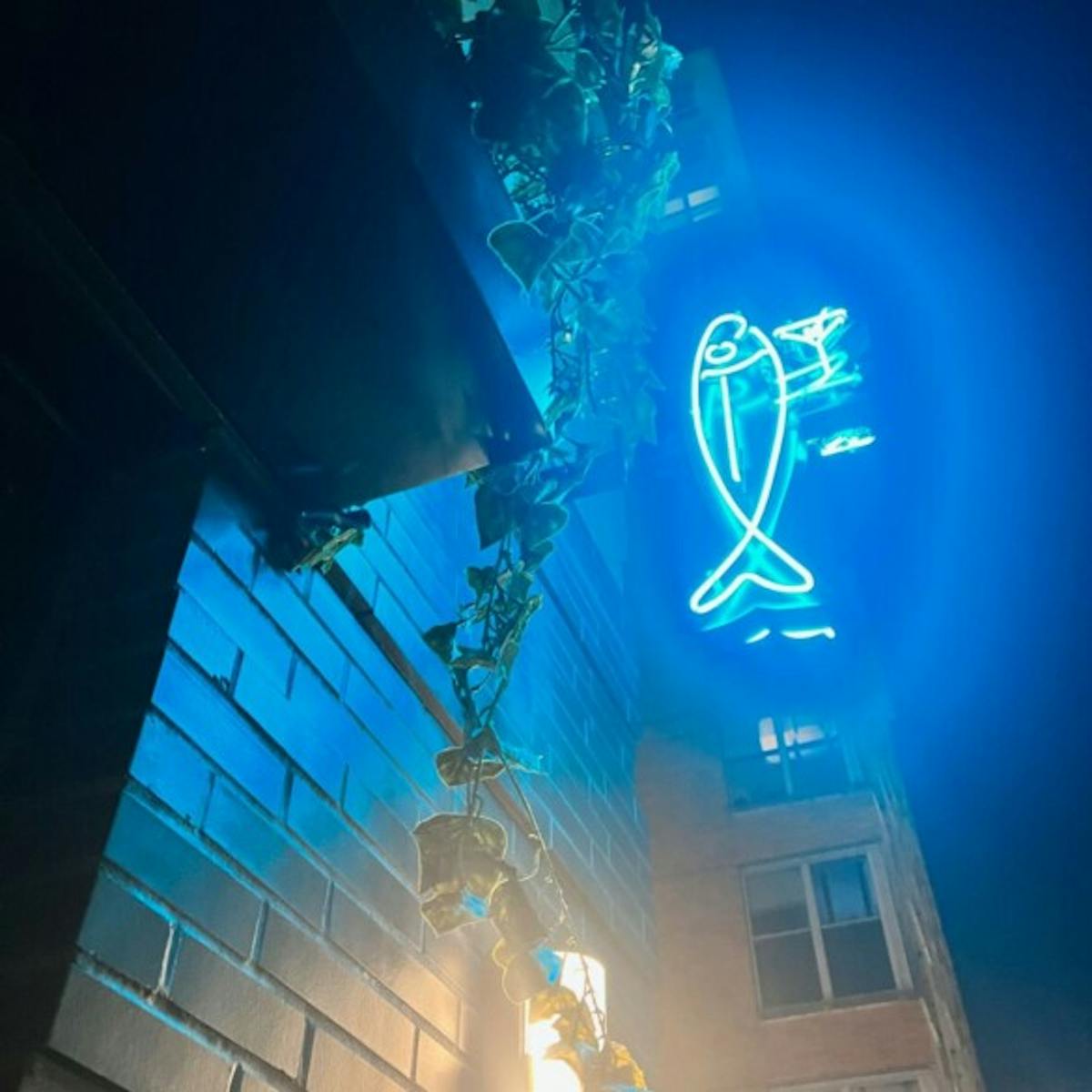 a sign on a stage in front of a building