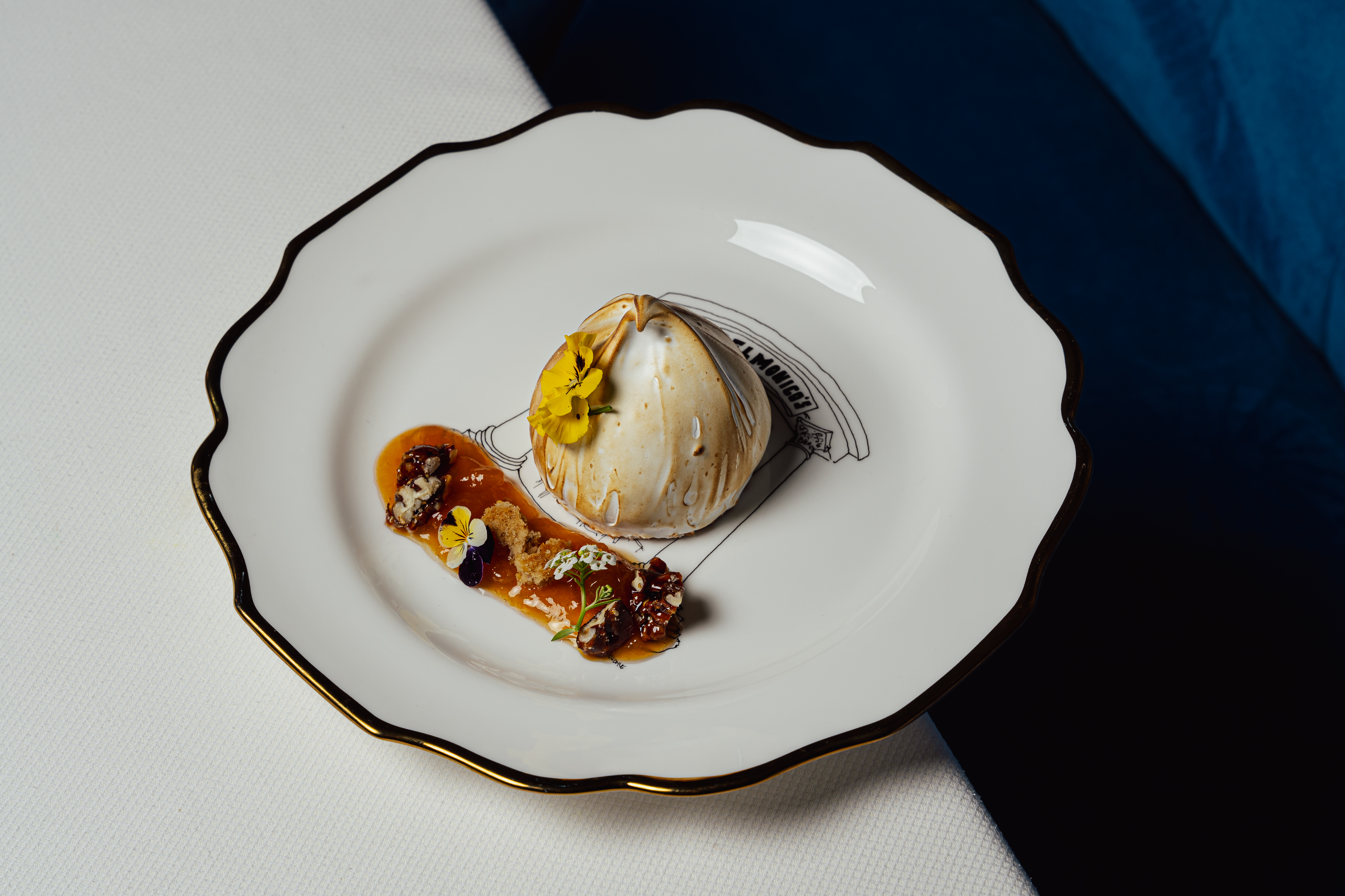 Candlelit dinner table at Delmonico's in the Financial District