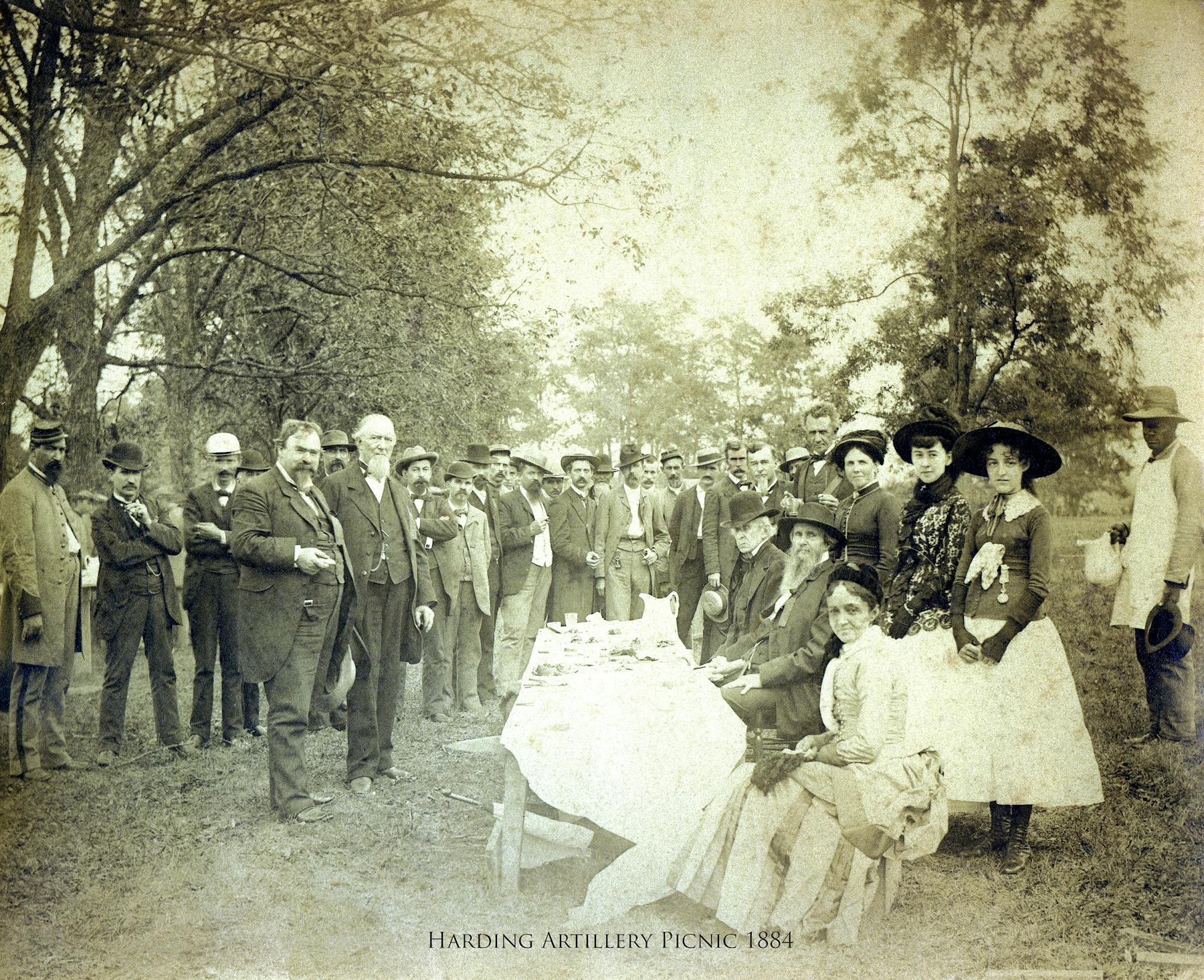 a vintage photo of a group of people posing for the camera