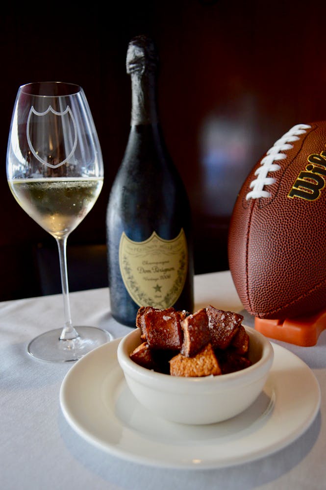 a plate of food and a glass of wine