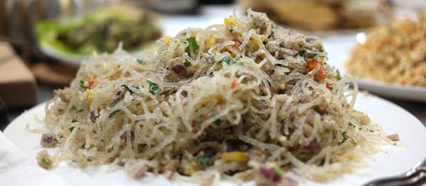a close up of a plate of food with rice and broccoli