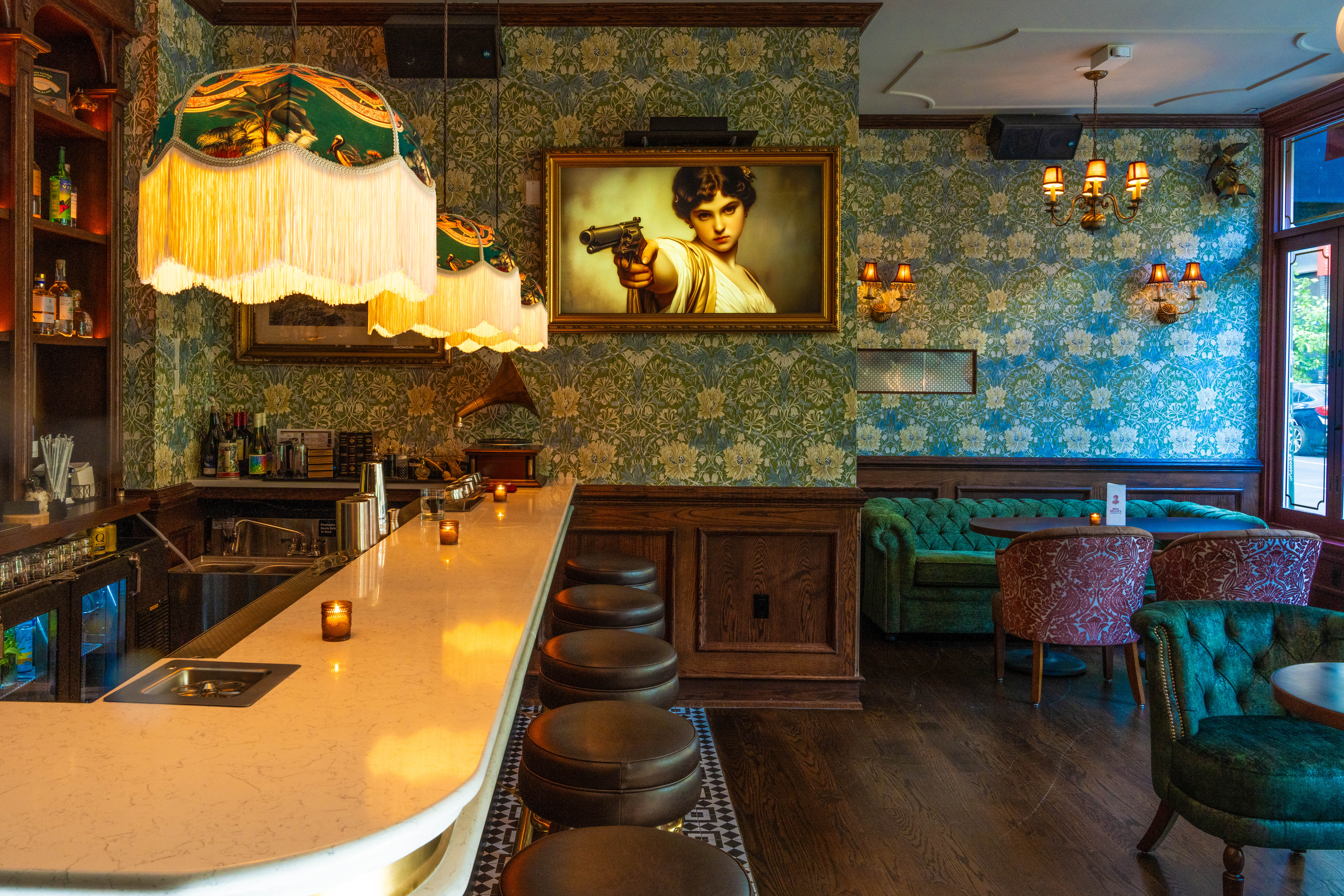 a chair sitting in front of a curtain