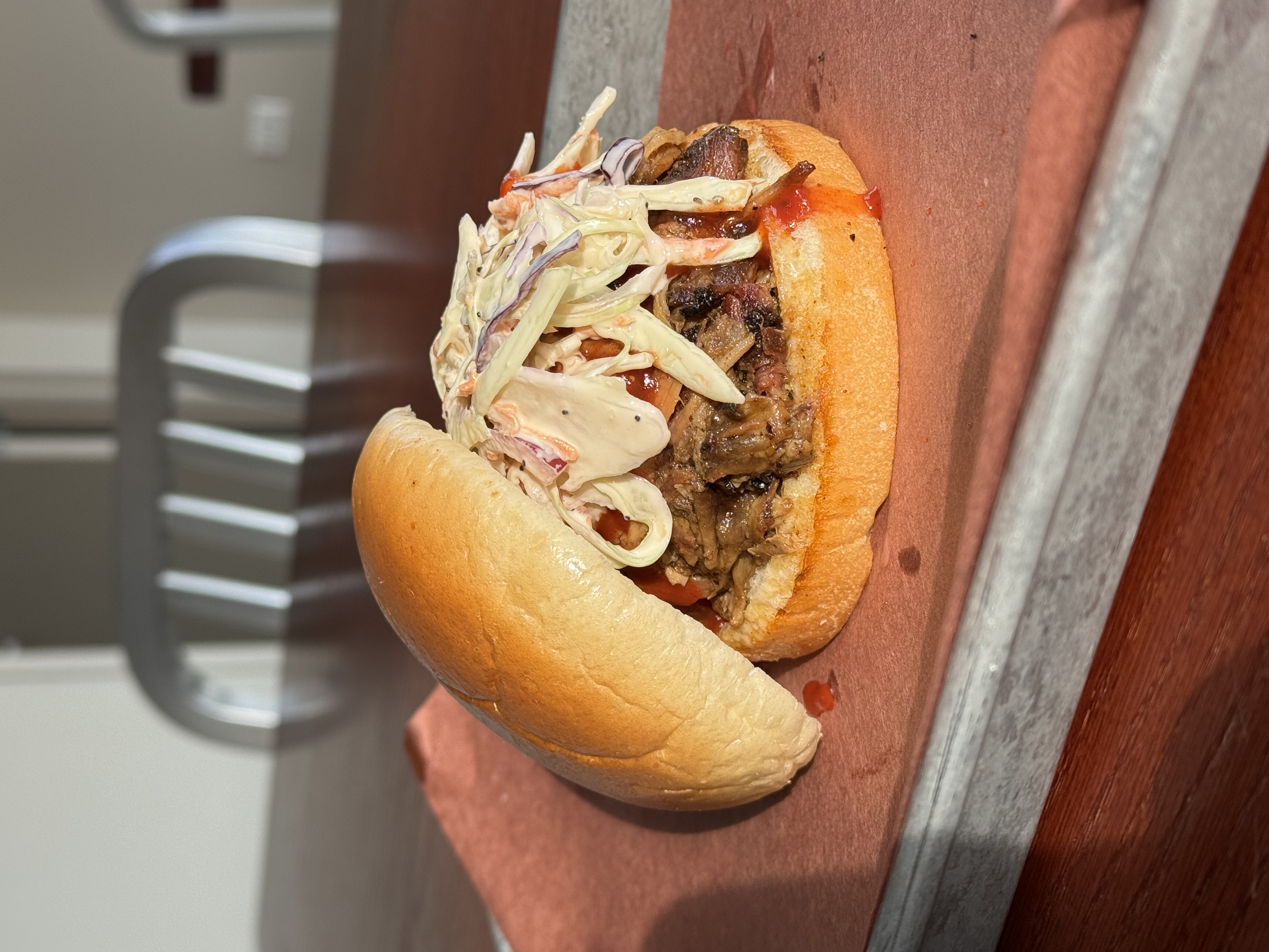 a sandwich sitting on top of a wooden table