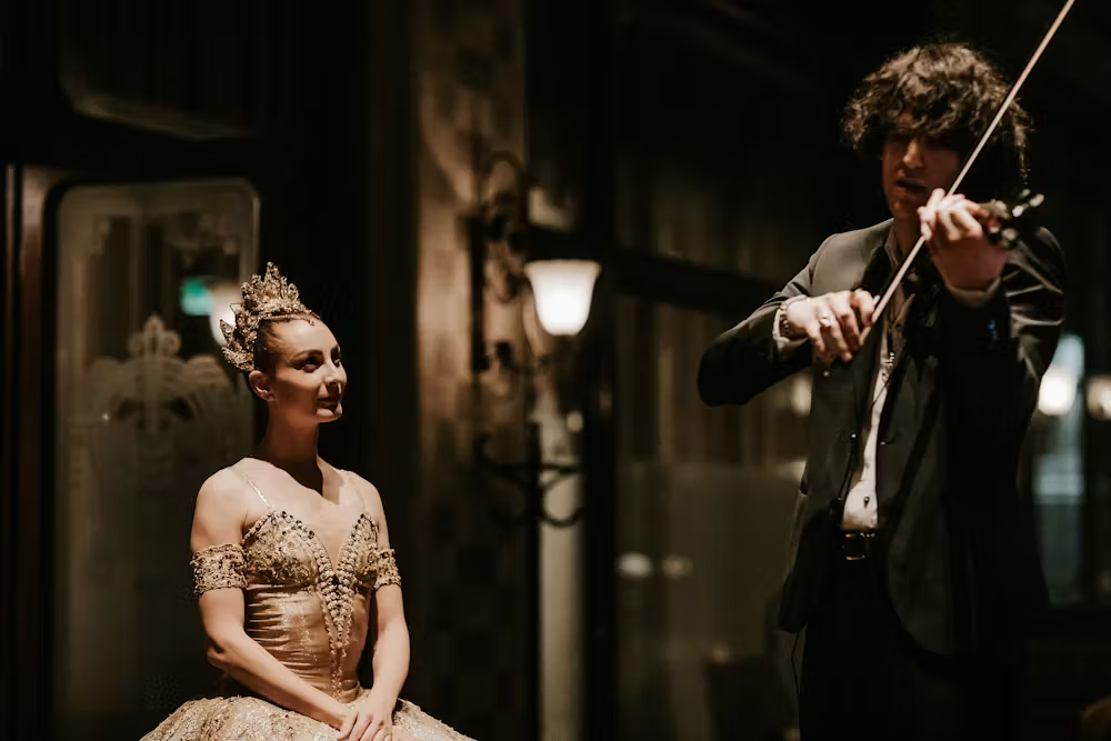 a man and a woman standing on a stage