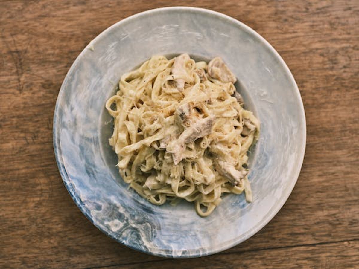 a bowl of fettuccine in a lemon cream vodka sauce