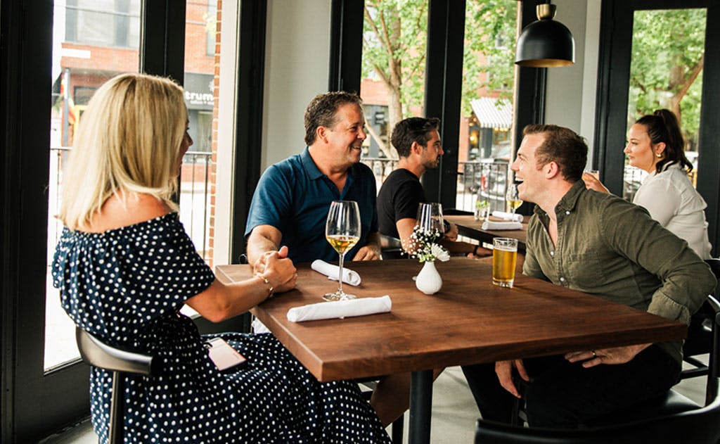 a group of people sitting at a table