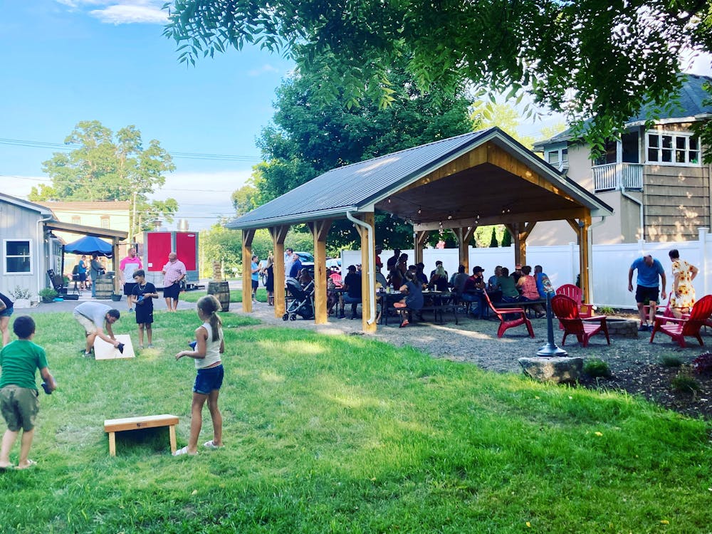 a group of people standing in a yard