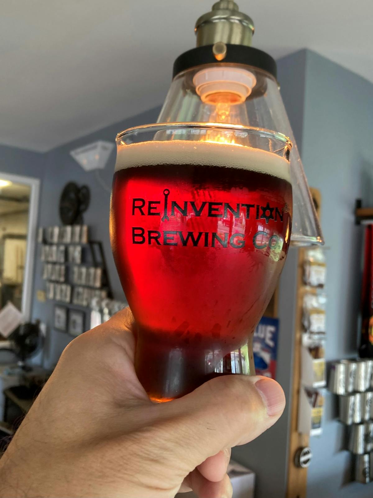 a close up of a person holding a wine glass