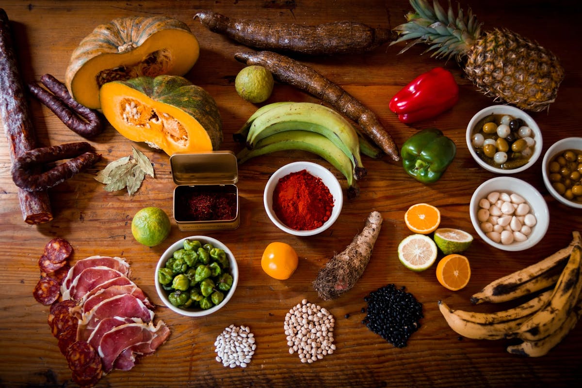 a wooden table topped with different types of food