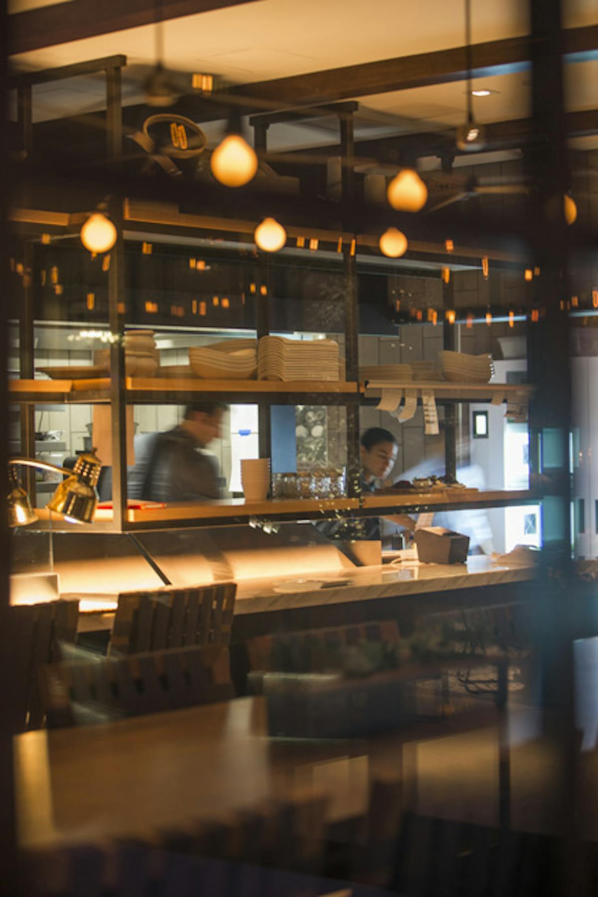 a kitchen with a table in a restaurant