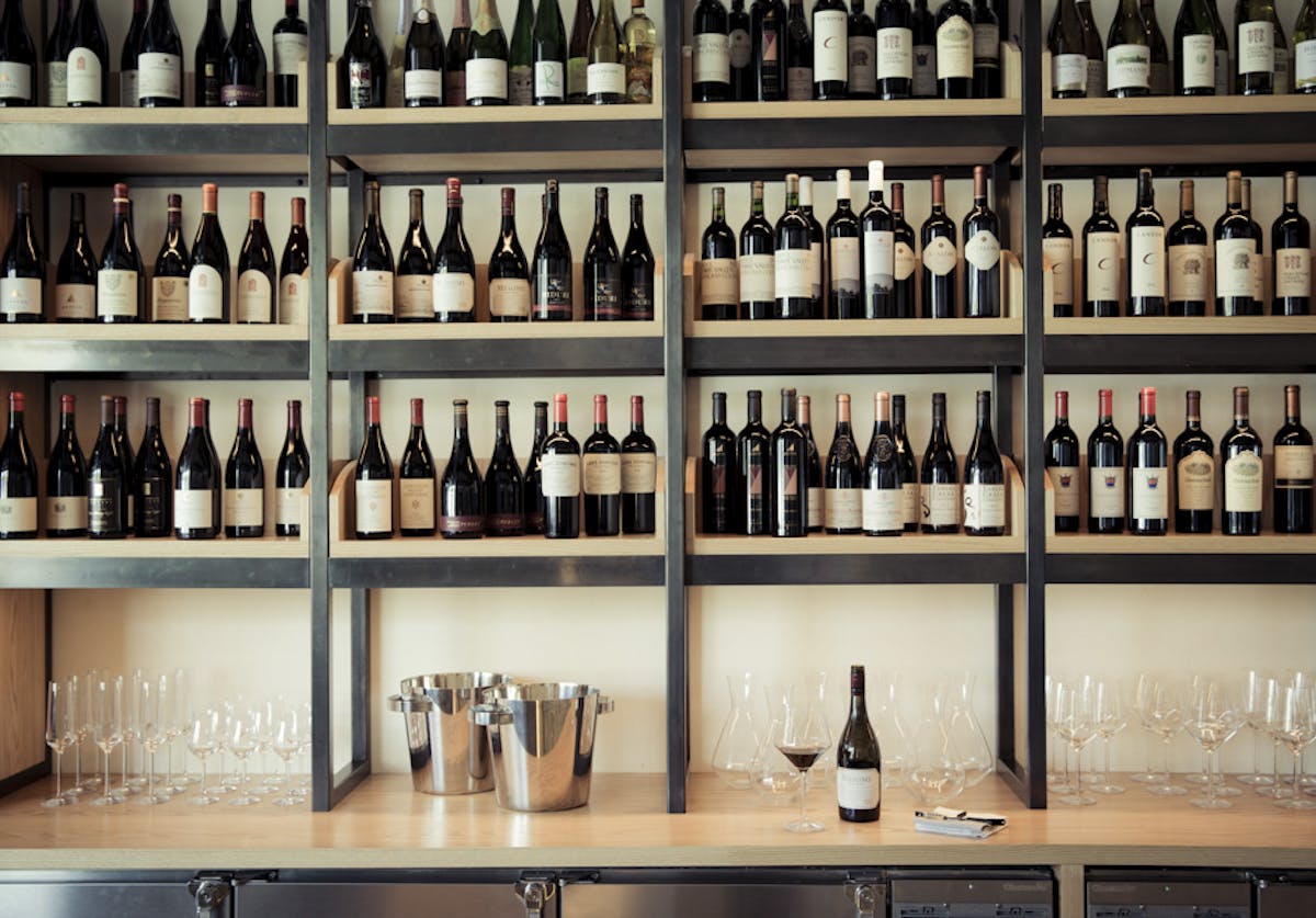 a store shelf filled with wine glasses