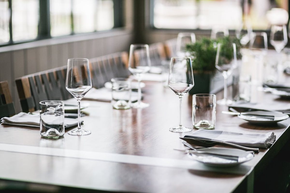 a dining table with wine glasses