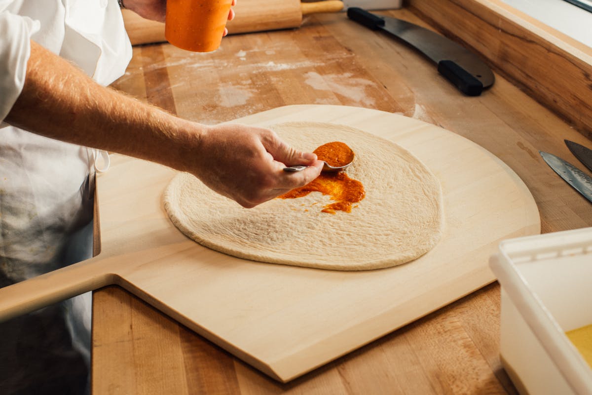 a person cutting food on a table