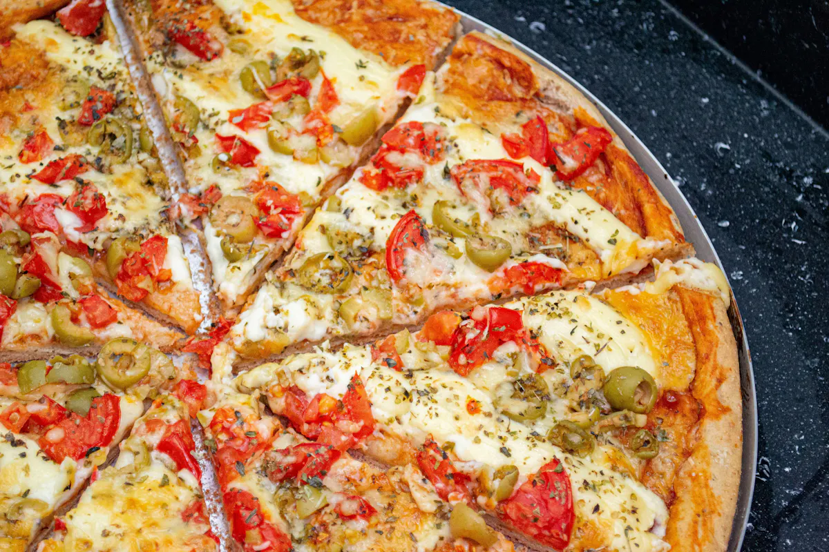 a pizza sitting on top of a pan
