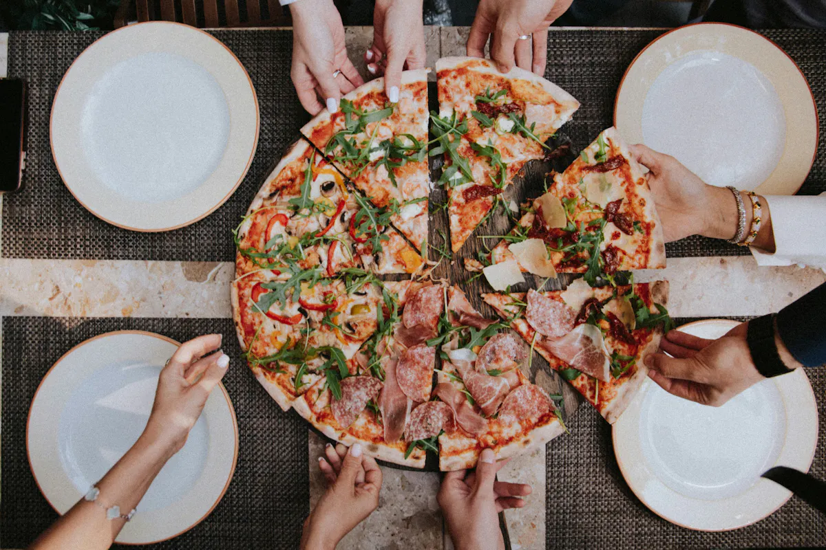 a pizza sitting on top of a plate of food
