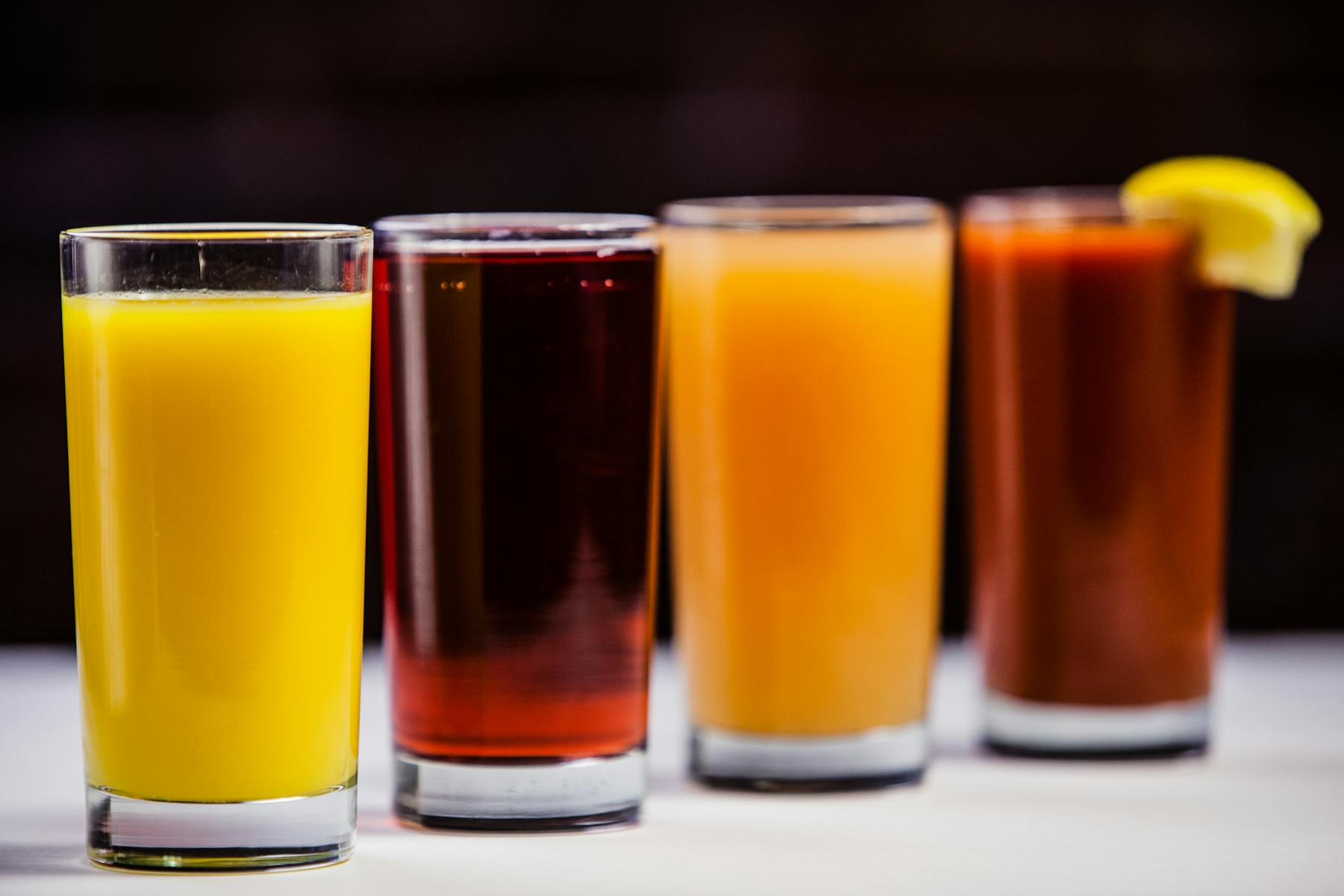a close up of a glasses of juice