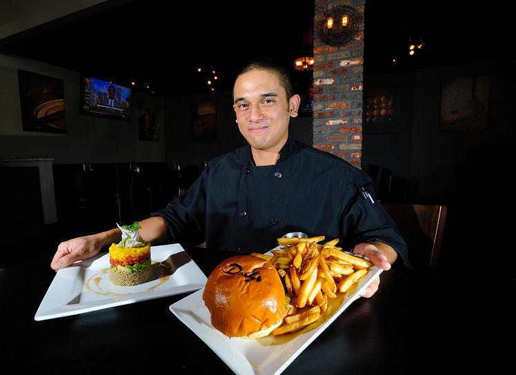 a man sitting at a table eating food