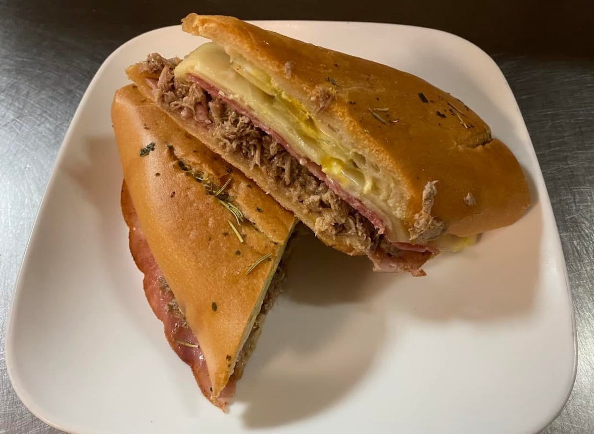 a sandwich sitting on top of a paper plate